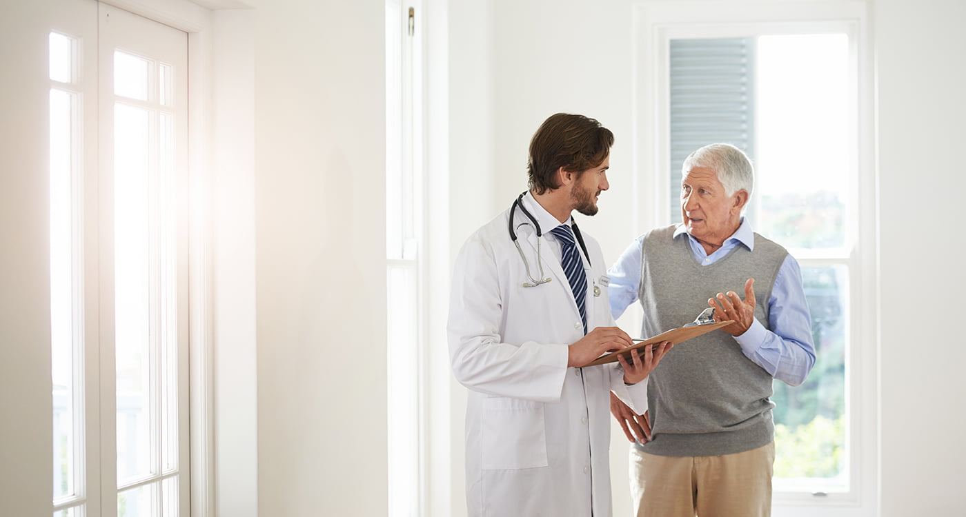 a doctor talking to his patient